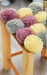 Grey, Yellow, and Pink Pom Pom Footstool with Natural Wood Frame