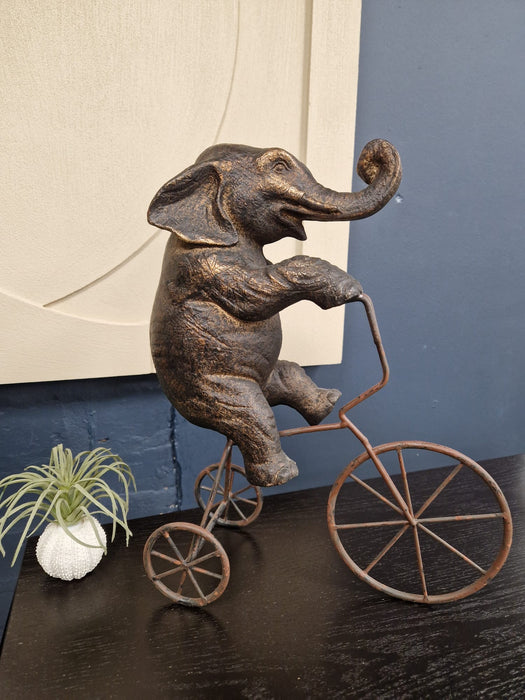 Antique Bronze Elephant on Bicycle Ornament – Whimsical Decorative Sculpture